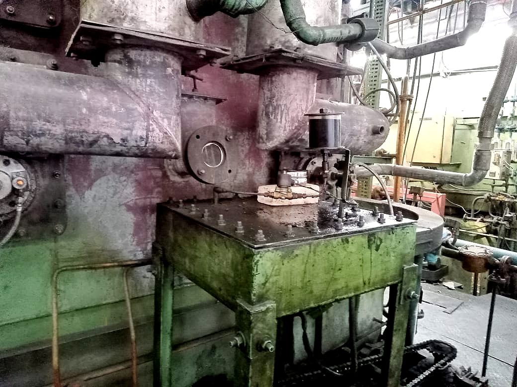 Charge loading mechanism beside the furnace