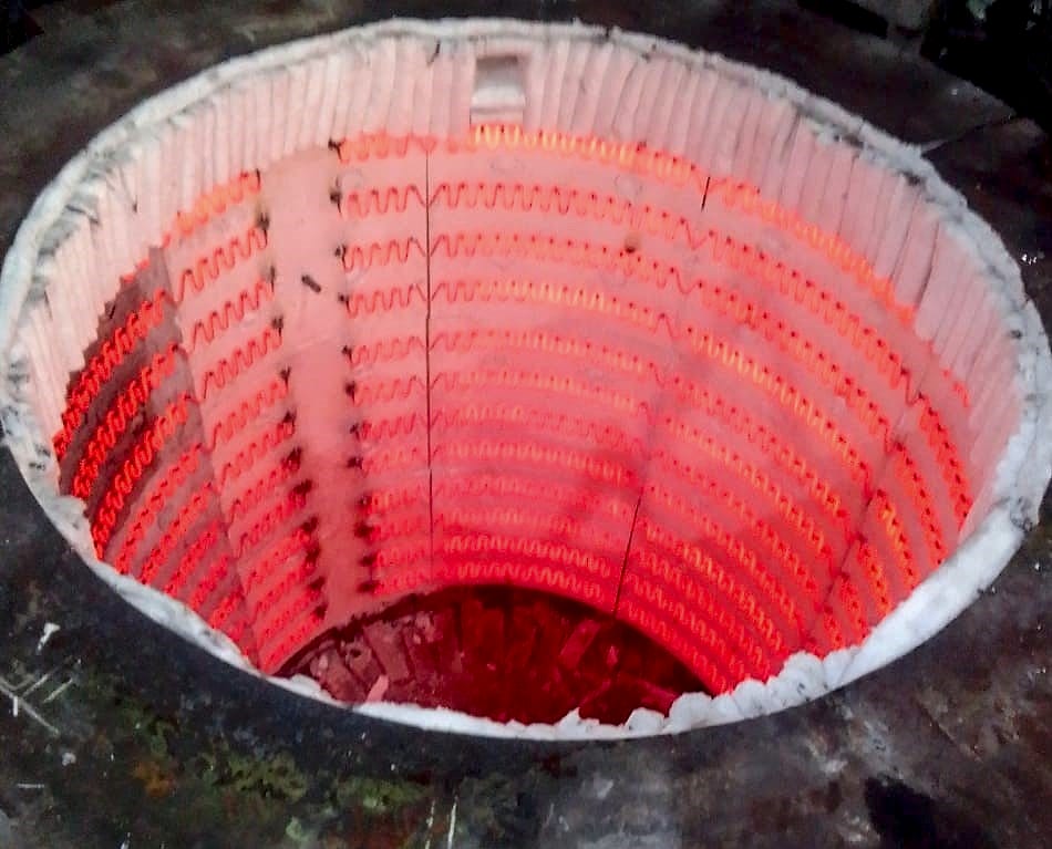 The furnace pit glowing at operating temperature after the retrofit