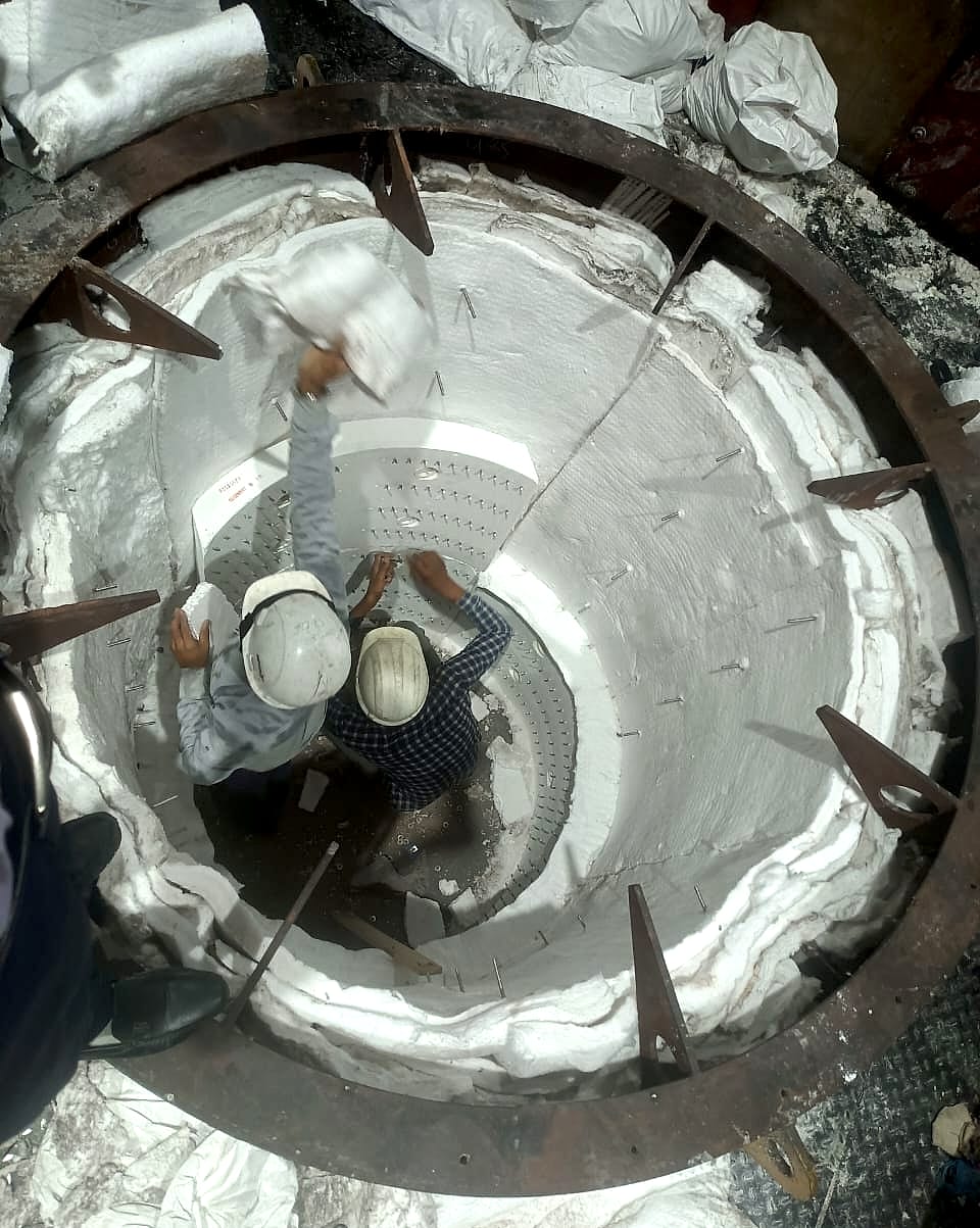 Technicians working inside the pit during the relining