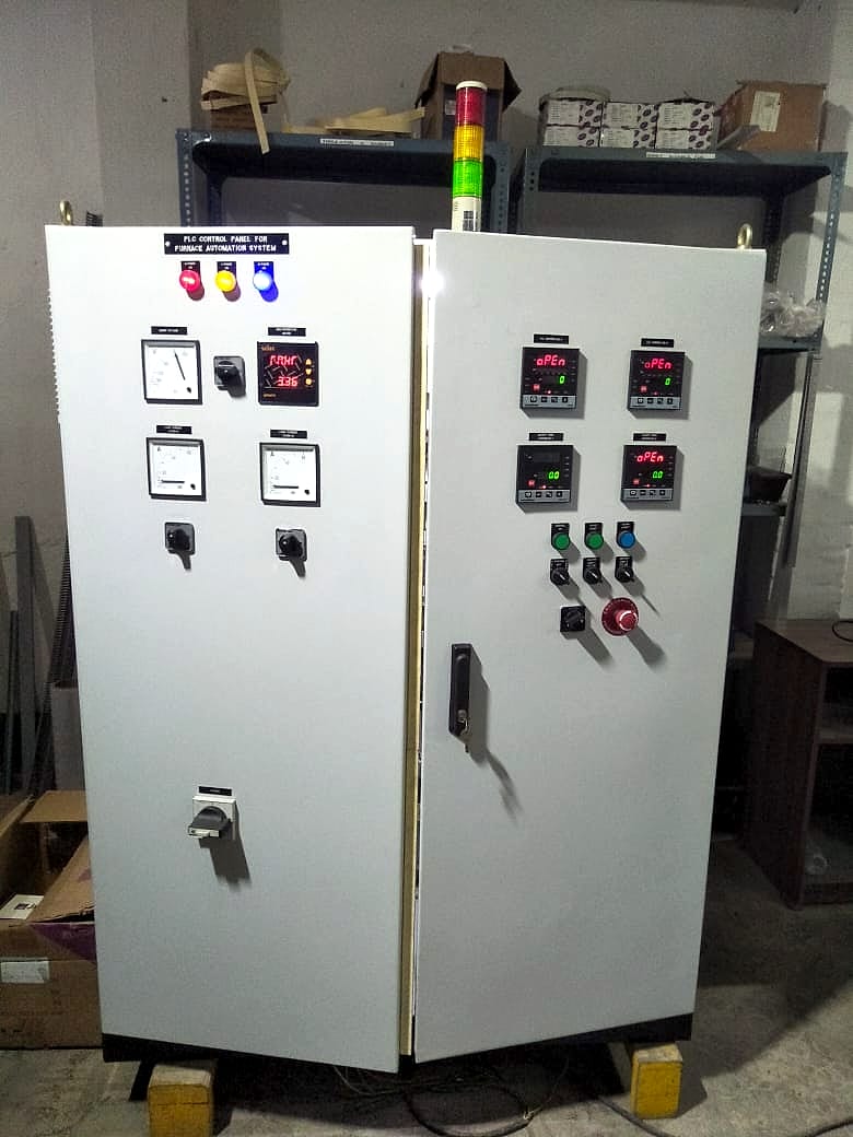 PLC control panel for furnace automation, with meters, temperature controllers and a tower light