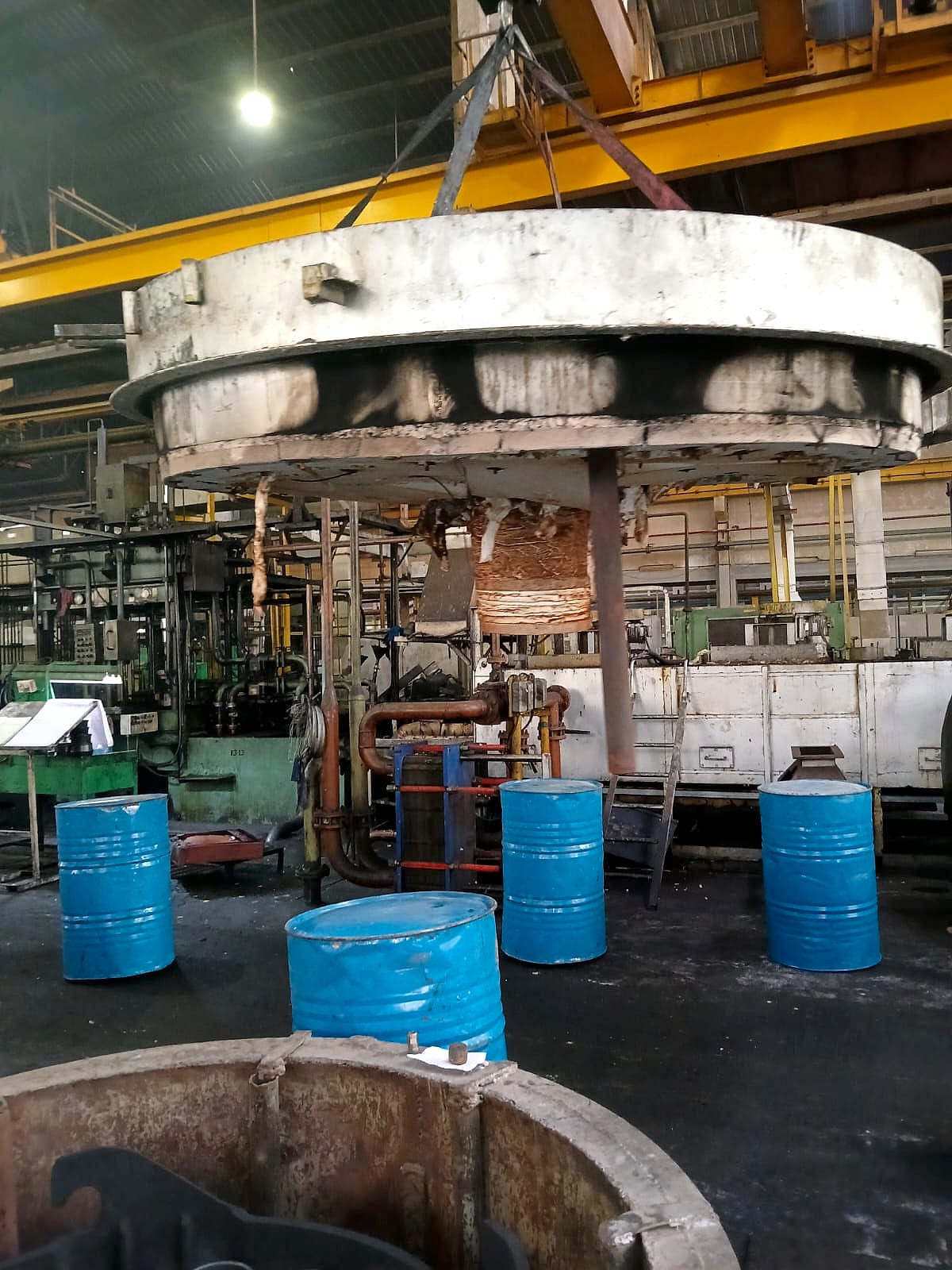 The furnace's top hood lifted off by crane