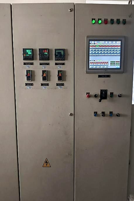 Rebuilt furnace control panel front with a new operator interface