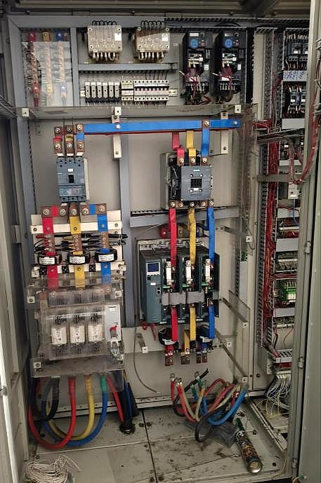 Inside the rebuilt control panel with new wiring, breakers and PLC